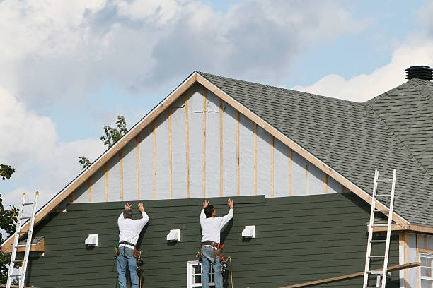 Professional Siding technician working in Warfield, VA